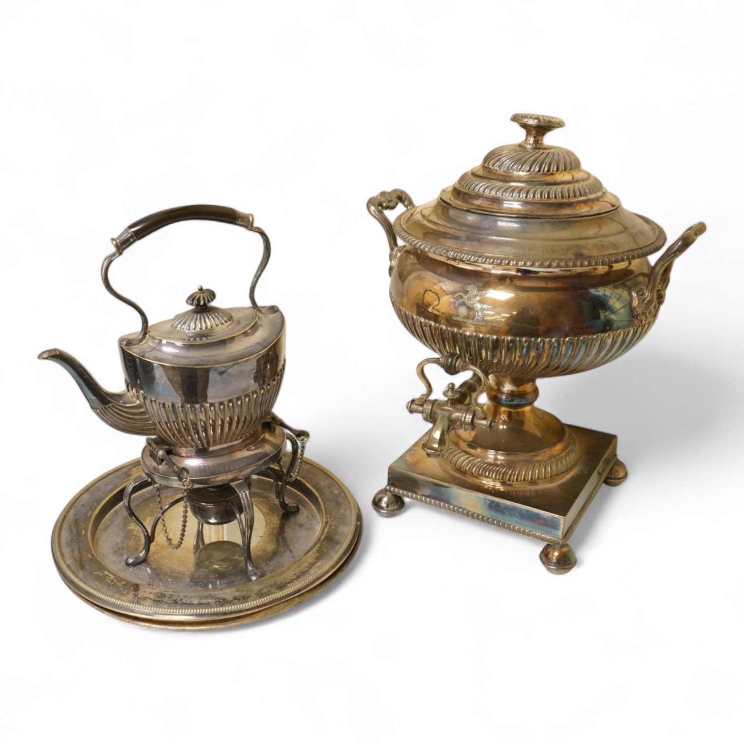 A Victorian silver plated urn, height 42cm, a silver plated spirit kettle and two circular dishes.